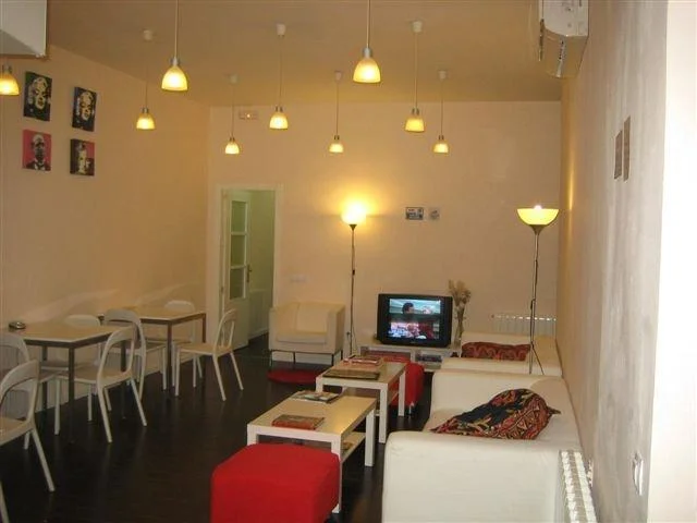 Communal lounge with white sofas and contemporary design